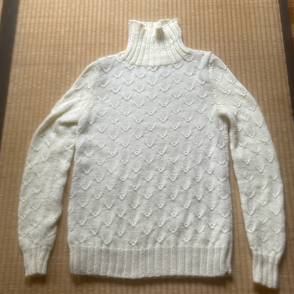 Off white fish scale knit turtleneck sweater.